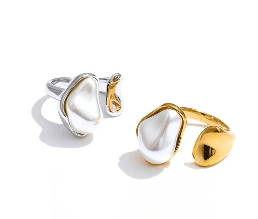 Elegant rings for everyday style: gold-tone linked hoops and a CZ-studded eternity ring on a wood branch.