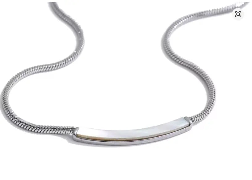 A silver snake chain necklace with a curved, polished silver bar pendant, displayed on a clean white background.